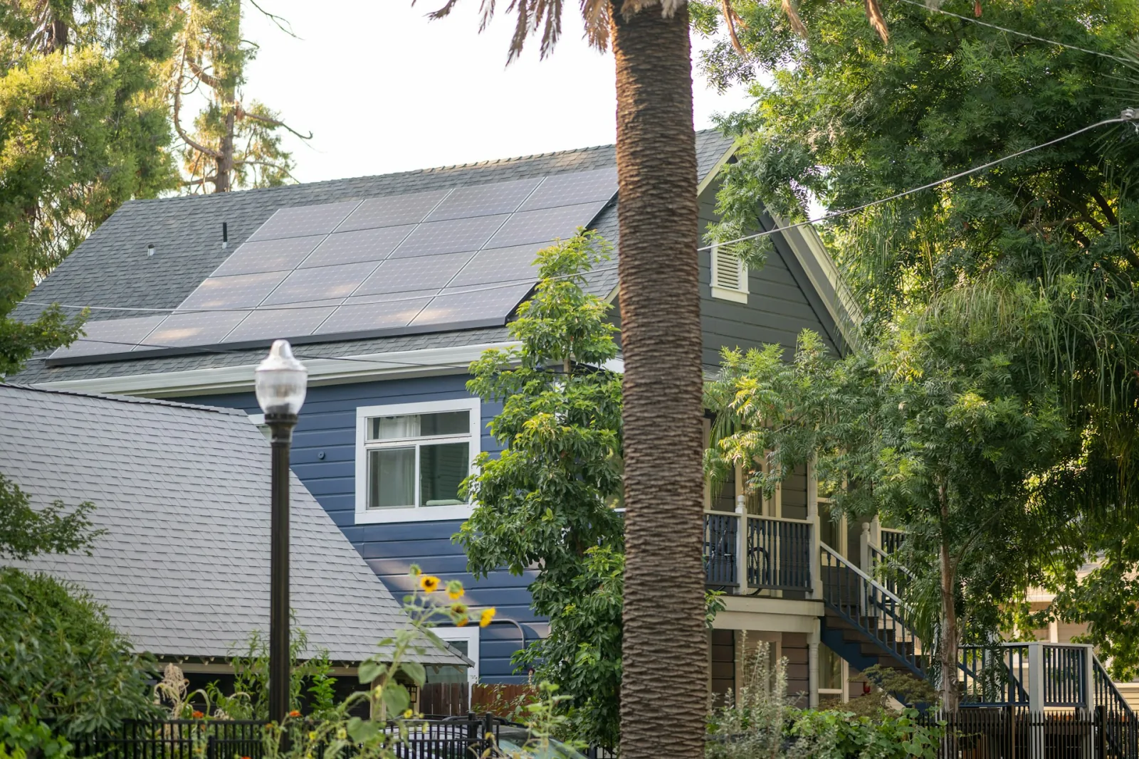 Blue California home with rooftop solar panels